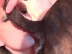 Woman giving Greek kiss to gifted dog