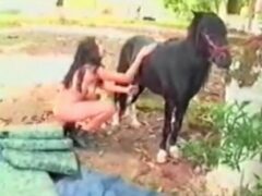 Sexy brunette sucking pony’s balls and cock